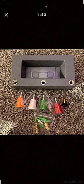 Pressure washer accessory wall mount and accessory nozzles